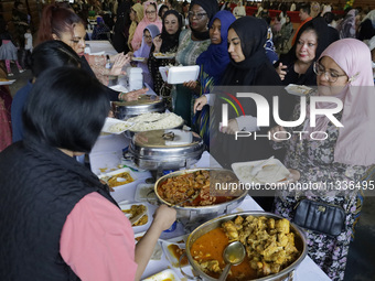 Members of the Muslim community in Mexico City, Mexico, on Eid al-Adha, are breaking their fast inside the facilities of the Plan Sexenal to...