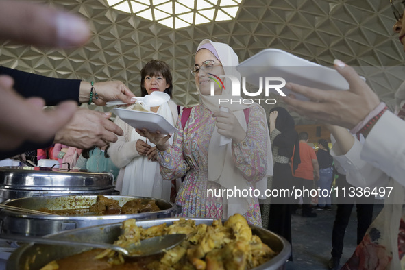 Members of the Muslim community in Mexico City, Mexico, on Eid al-Adha, are breaking their fast inside the facilities of the Plan Sexenal to...