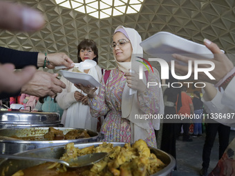 Members of the Muslim community in Mexico City, Mexico, on Eid al-Adha, are breaking their fast inside the facilities of the Plan Sexenal to...