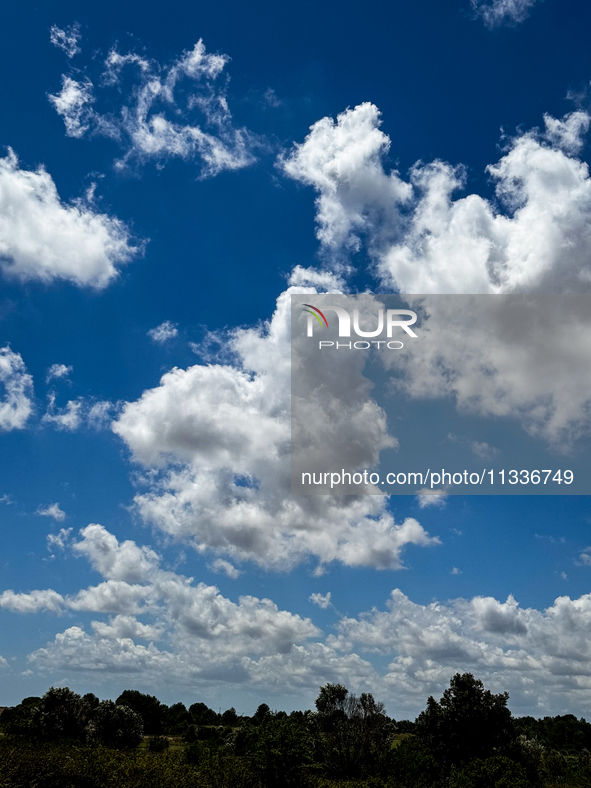 A heart-shaped cumulus cloud floats in the blue sky over Lecce, Italy, on June 14, 2024. 