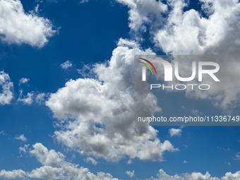 A heart-shaped cumulus cloud floats in the blue sky over Lecce, Italy, on June 14, 2024. (