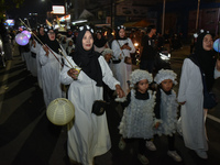 Hundreds of children are dressing as sheep during a lantern parade to celebrate Eid al-Adha on the city streets in Malang, East Java, Indone...