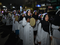 Hundreds of participants are carrying lanterns and posters as they celebrate Eid al-Adha on the city streets in Malang, East Java, Indonesia...