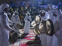 A Qatari traditional band is performing during the celebration of the first day of the Eid Al-Adha festival at Katara Cultural Village in Do...