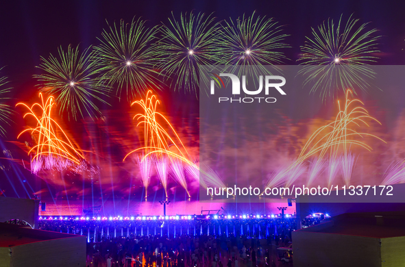 Fireworks are lighting up the sky over Katara Cultural Village during the celebration of the first day of the Eid Al-Adha festival in Doha,...