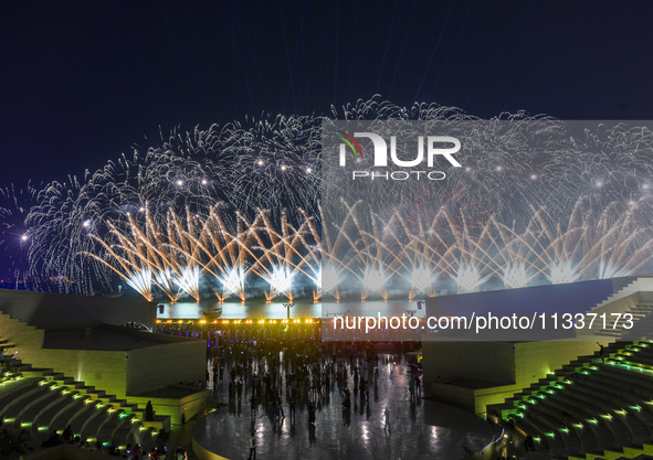 Fireworks are lighting up the sky over Katara Cultural Village during the celebration of the first day of the Eid Al-Adha festival in Doha,...