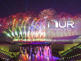 Fireworks are lighting up the sky over Katara Cultural Village during the celebration of the first day of the Eid Al-Adha festival in Doha,...