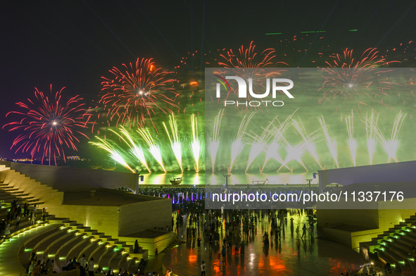 Fireworks are lighting up the sky over Katara Cultural Village during the celebration of the first day of the Eid Al-Adha festival in Doha,...