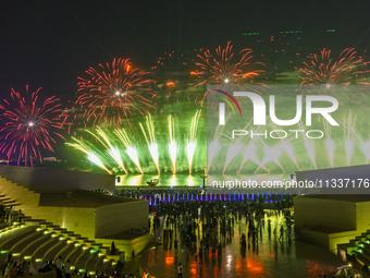 Fireworks are lighting up the sky over Katara Cultural Village during the celebration of the first day of the Eid Al-Adha festival in Doha,...