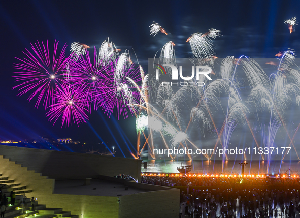 Fireworks are lighting up the sky over Katara Cultural Village during the celebration of the first day of the Eid Al-Adha festival in Doha,...