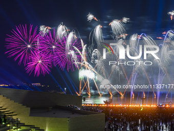 Fireworks are lighting up the sky over Katara Cultural Village during the celebration of the first day of the Eid Al-Adha festival in Doha,...