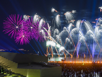 Fireworks are lighting up the sky over Katara Cultural Village during the celebration of the first day of the Eid Al-Adha festival in Doha,...