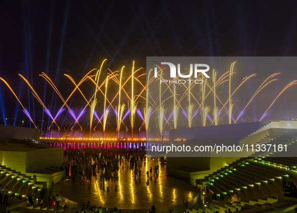 Fireworks are lighting up the sky over Katara Cultural Village during the celebration of the first day of the Eid Al-Adha festival in Doha,...