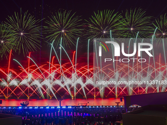 Fireworks are lighting up the sky over Katara Cultural Village during the celebration of the first day of the Eid Al-Adha festival in Doha,...