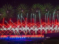 Fireworks are lighting up the sky over Katara Cultural Village during the celebration of the first day of the Eid Al-Adha festival in Doha,...