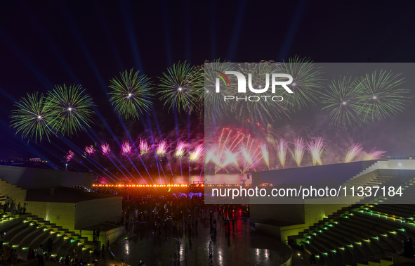 Fireworks are lighting up the sky over Katara Cultural Village during the celebration of the first day of the Eid Al-Adha festival in Doha,...