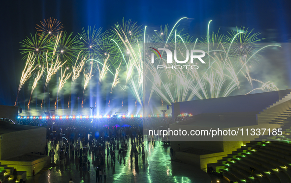 Fireworks are lighting up the sky over Katara Cultural Village during the celebration of the first day of the Eid Al-Adha festival in Doha,...