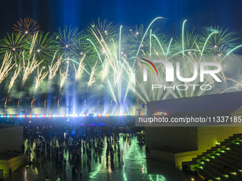 Fireworks are lighting up the sky over Katara Cultural Village during the celebration of the first day of the Eid Al-Adha festival in Doha,...