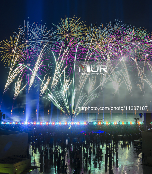 Fireworks are lighting up the sky over Katara Cultural Village during the celebration of the first day of the Eid Al-Adha festival in Doha,...