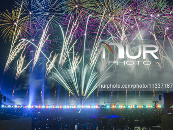 Fireworks are lighting up the sky over Katara Cultural Village during the celebration of the first day of the Eid Al-Adha festival in Doha,...