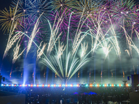 Fireworks are lighting up the sky over Katara Cultural Village during the celebration of the first day of the Eid Al-Adha festival in Doha,...