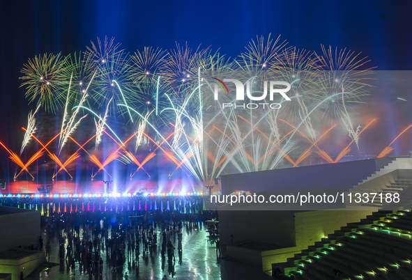 Fireworks are lighting up the sky over Katara Cultural Village during the celebration of the first day of the Eid Al-Adha festival in Doha,...