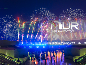 Fireworks are lighting up the sky over Katara Cultural Village during the celebration of the first day of the Eid Al-Adha festival in Doha,...