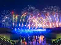 Fireworks are lighting up the sky over Katara Cultural Village during the celebration of the first day of the Eid Al-Adha festival in Doha,...