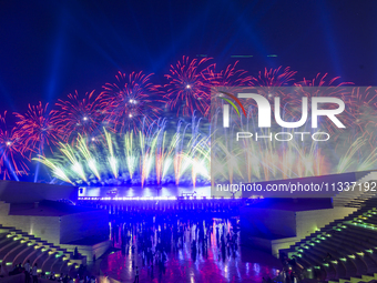 Fireworks are lighting up the sky over Katara Cultural Village during the celebration of the first day of the Eid Al-Adha festival in Doha,...