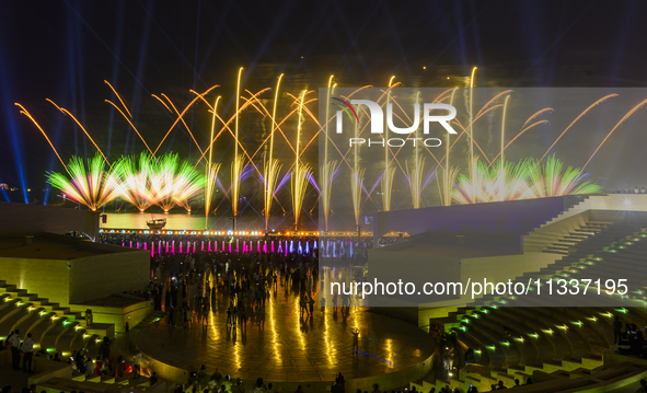 Fireworks are lighting up the sky over Katara Cultural Village during the celebration of the first day of the Eid Al-Adha festival in Doha,...