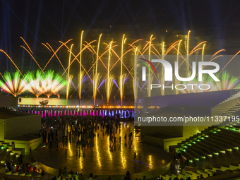 Fireworks are lighting up the sky over Katara Cultural Village during the celebration of the first day of the Eid Al-Adha festival in Doha,...