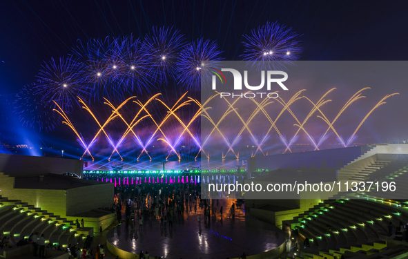 Fireworks are lighting up the sky over Katara Cultural Village during the celebration of the first day of the Eid Al-Adha festival in Doha,...