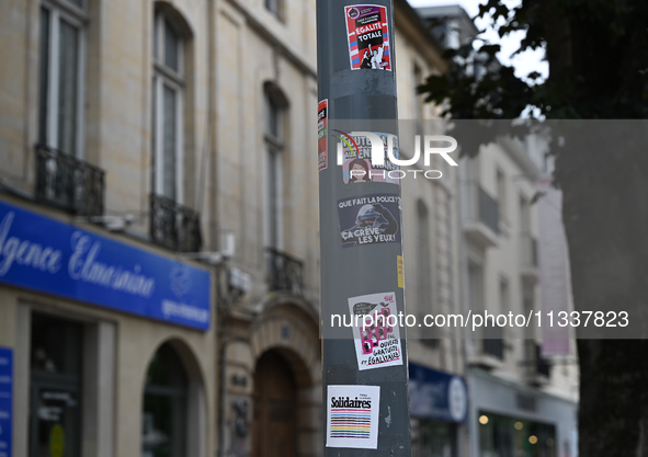 CAEN, FRANCE - JUNE 16: 
One of the many road signs adorned with stickers left by participants of the 2024 Pride Parade in the Caen city cen...