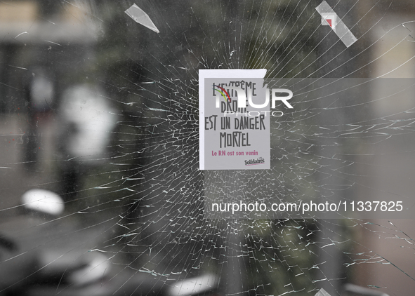 CAEN, FRANCE - JUNE 16: 
A message-sticker left on a vandalized shop window by participants of the 2024 Pride Parade in Caen city center, se...