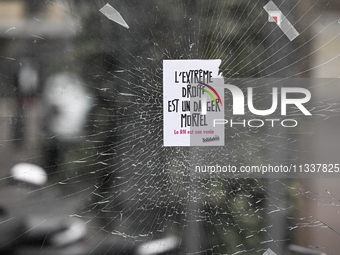 CAEN, FRANCE - JUNE 16: 
A message-sticker left on a vandalized shop window by participants of the 2024 Pride Parade in Caen city center, se...