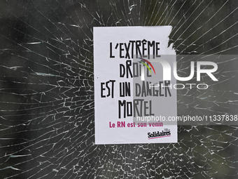 CAEN, FRANCE - JUNE 16: 
A message-sticker left on a vandalized shop window by participants of the 2024 Pride Parade in Caen city center, se...