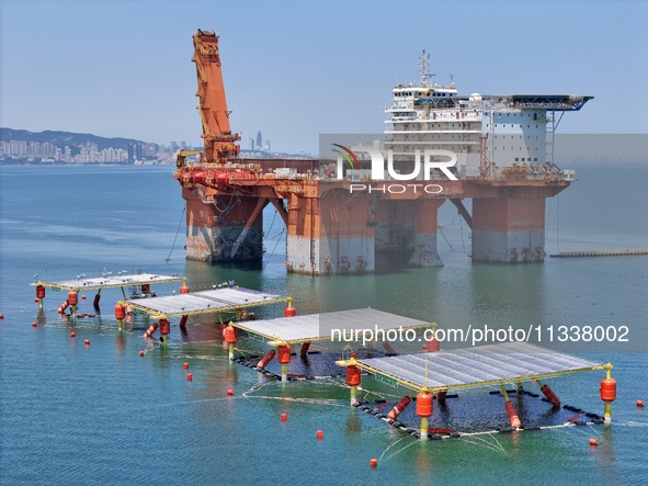 An offshore PV demonstration base and floating PV platform are operating in Yantai, China, on June 16, 2024. 