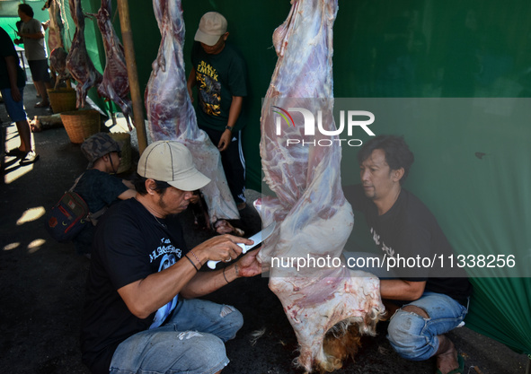 (EDITOR'S NOTE: Graphic content) Residents are working together to cut hundreds of goats to be distributed to the public during the Eid al-A...