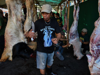 (EDITOR'S NOTE: Graphic content) Residents are working together to cut hundreds of goats to be distributed to the public during the Eid al-A...