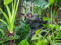 Officers and soldiers are conducting a comprehensive anti-terrorism drill in the wild in an unfamiliar area in Beihai, China, on June 17, 20...