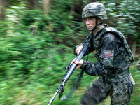 Officers and soldiers are conducting a comprehensive anti-terrorism drill in the wild in an unfamiliar area in Beihai, China, on June 17, 20...