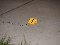 An evidence marker is showing an object from the attempted robbery at the scene. A 35-year-old male victim is in critical condition after be...