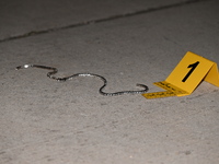 An evidence marker is showing an object from the attempted robbery at the scene. A 35-year-old male victim is in critical condition after be...