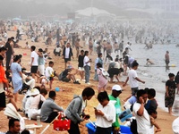 Tourists are enjoying the cool water at the No. 1 Bathing Beach in Qingdao, China, on June 17, 2024. (