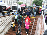 Activists are going down to an underground passage at a metro station during the Equality March organized by KyivPride NGO for the first tim...