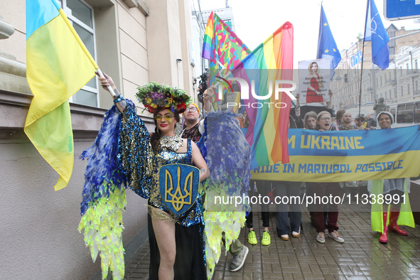 An activist is partaking in the Equality March organized by KyivPride NGO for the first time since the 2022 Russian invasion of Ukraine, in...