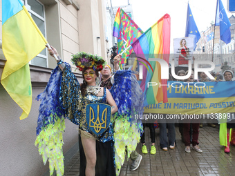 An activist is partaking in the Equality March organized by KyivPride NGO for the first time since the 2022 Russian invasion of Ukraine, in...