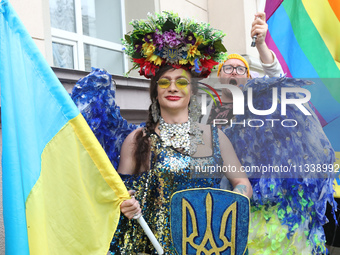 An activist is partaking in the Equality March organized by KyivPride NGO for the first time since the 2022 Russian invasion of Ukraine, in...