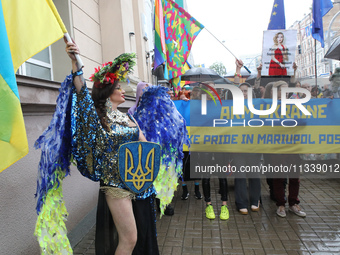 An activist is partaking in the Equality March organized by KyivPride NGO for the first time since the 2022 Russian invasion of Ukraine, in...