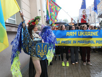 An activist is partaking in the Equality March organized by KyivPride NGO for the first time since the 2022 Russian invasion of Ukraine, in...